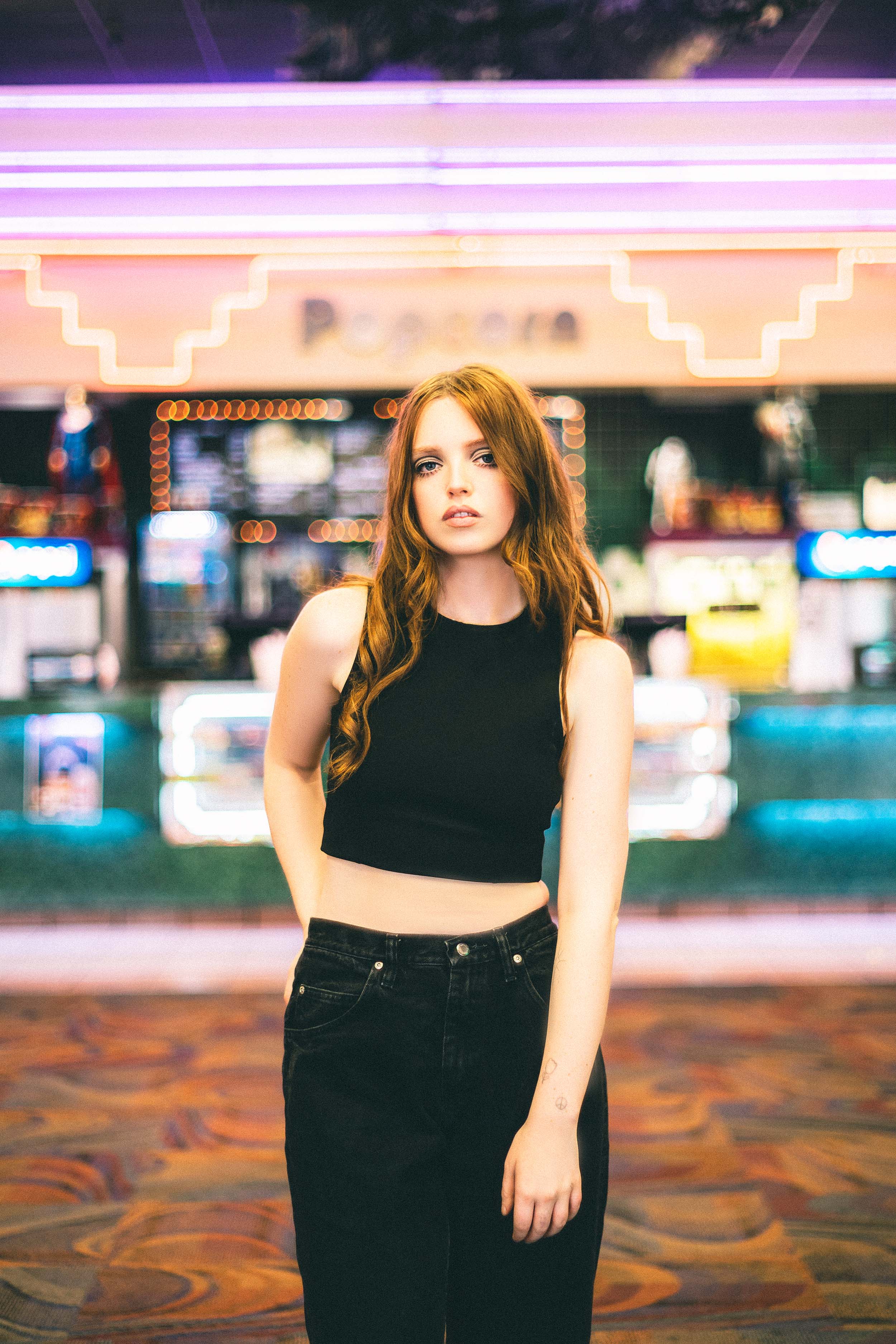 Cinematic Portraits with Vintage Flair by a Movie Theater — photograph 6 of 35